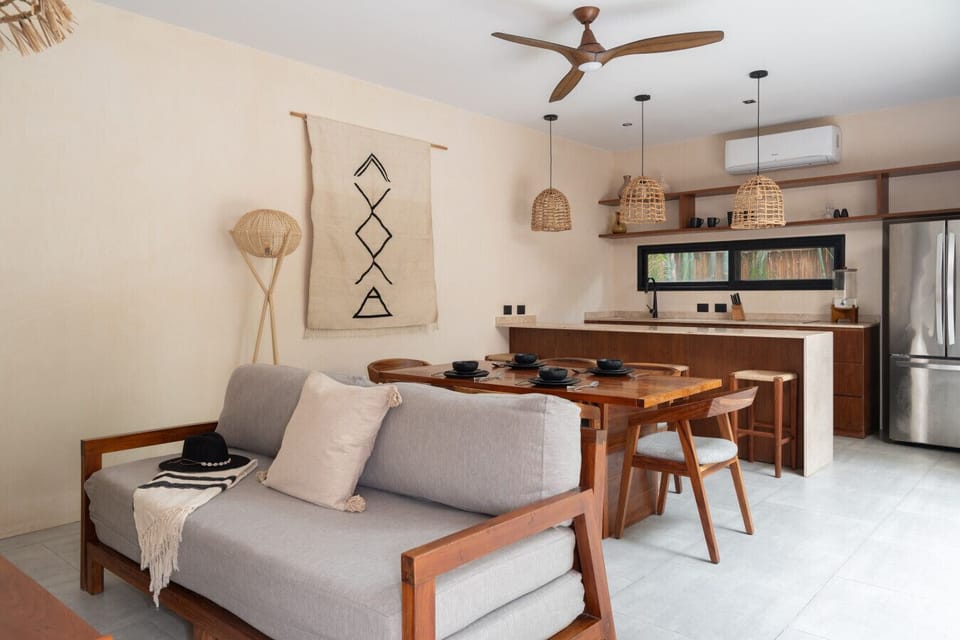 A cozy, open living space with natural finishes, dining area, and modern kitchen.