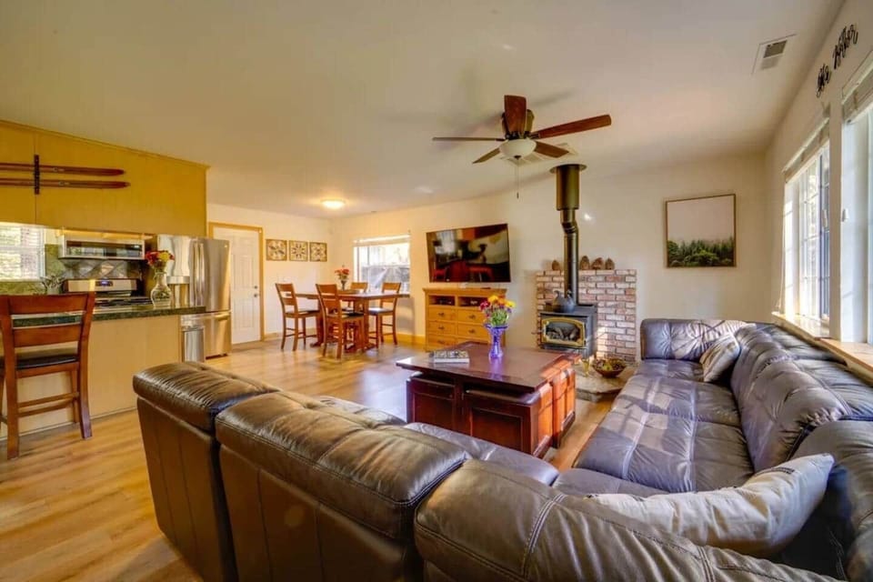 Large living room with comfy sofa and open kitchen