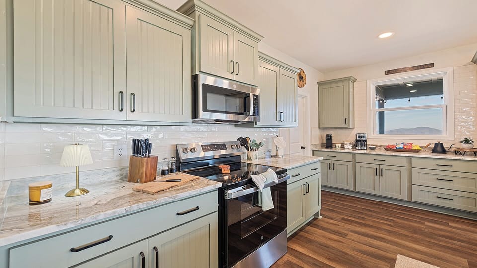 Large kitchen, full pantry and new appliances as well as fully stocked cabinets