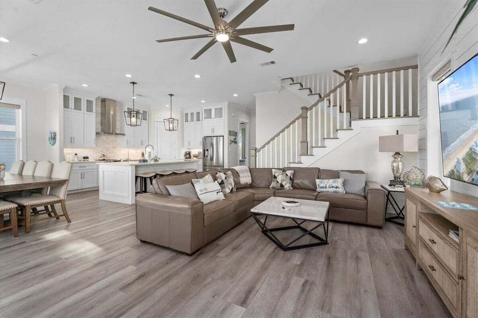Open floor plan living and kitchen space ideal for large groups staying at this Galveston beachfront vacation home.