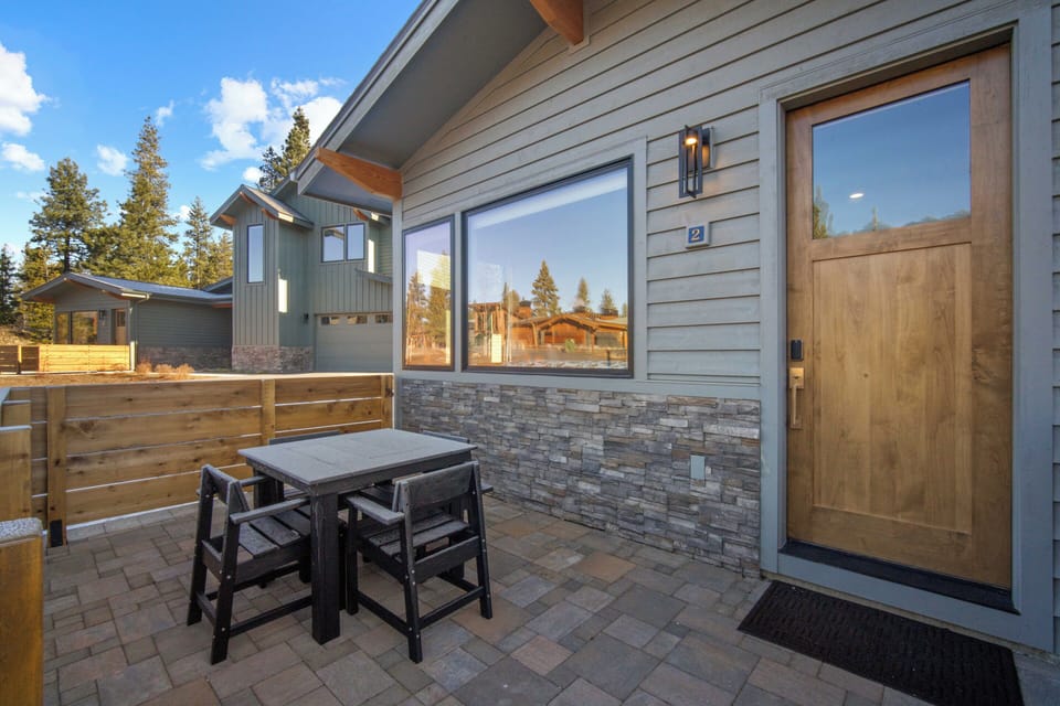 Step onto your private patio and enjoy al fresco dining with mountain views through expansive windows.