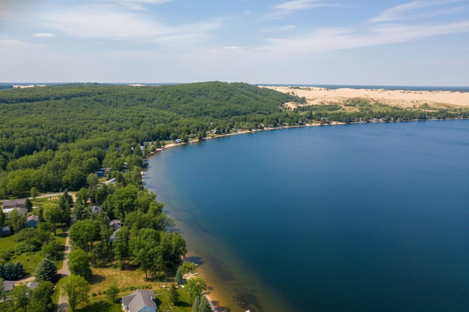 Wake up to views of Little Glen Lake with the iconic Sleeping Bear Dunes stretching across the horizon. One of Northern Michigan’s most scenic and sought-after landscapes.