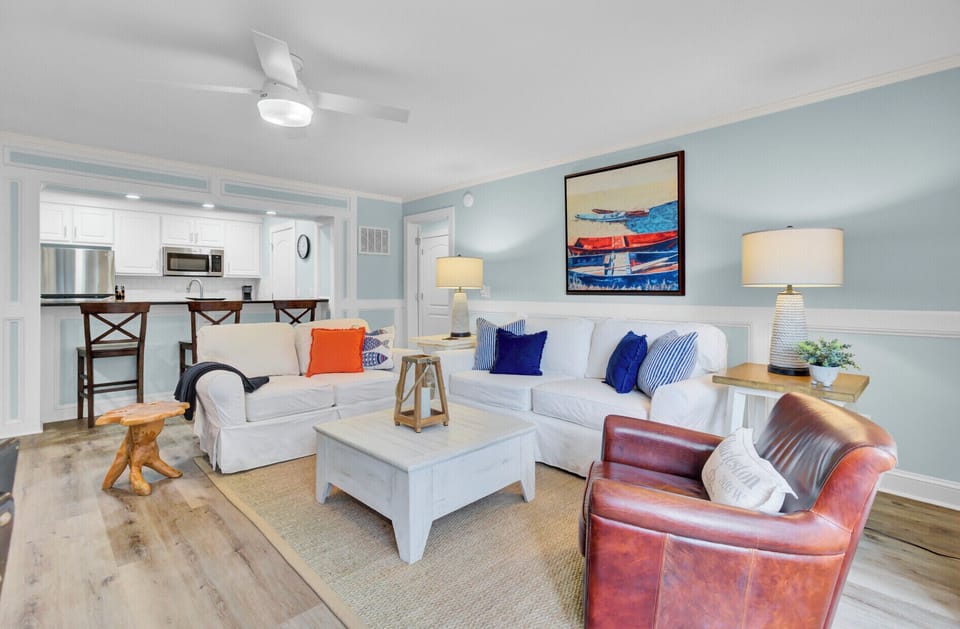 Sink into plush coastal comfort with nautical touches and open-concept flow to your fully equipped kitchen.