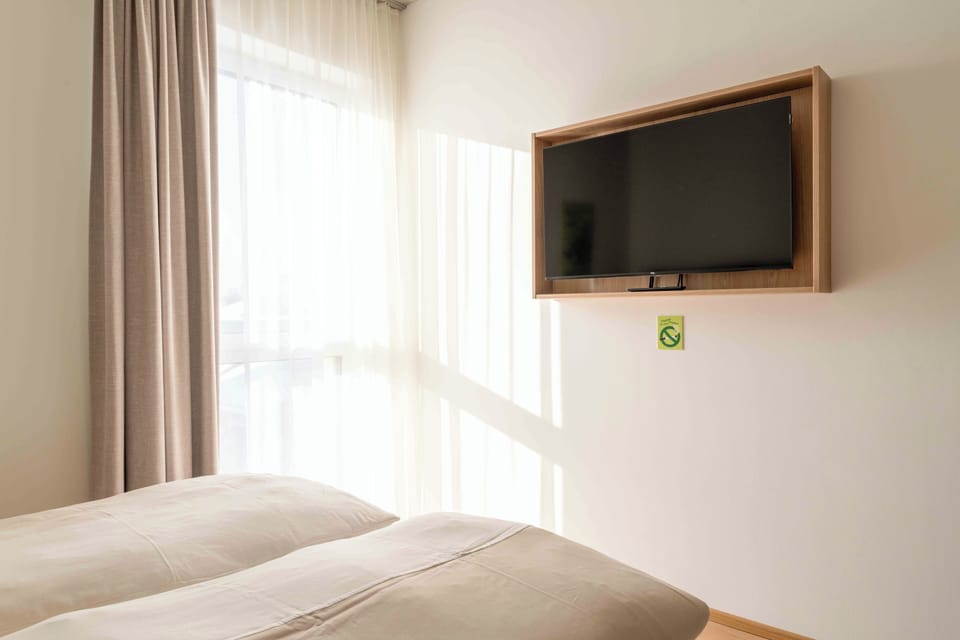 Desk, laptop workspace, free WiFi, bed sheets