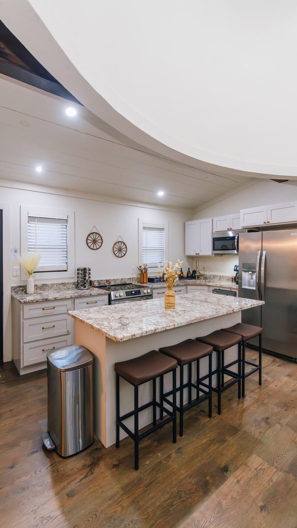 Your breakfast station. With comfortable bar seating for four, the quartz island is the perfect spot to map out your day`s adventures over a bagel and juice.