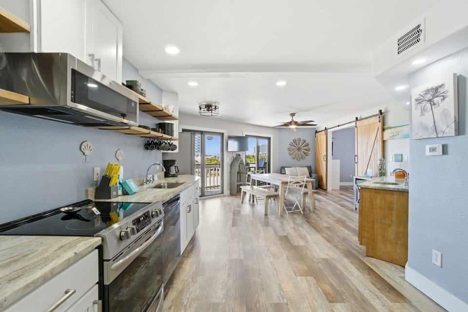 Regatta Condo 201A- Kitchen to Dining & Balcony