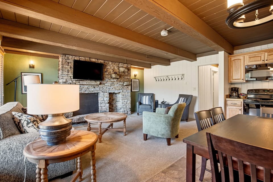 The inviting living area combines cozy interiors with stylish decor, perfect for family gatherings after a day of exploration in the stunning mountain views.
