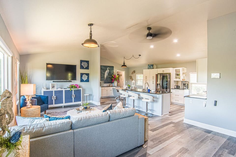 Stylish clean living area | Open to kitchen & dining | Canal Views