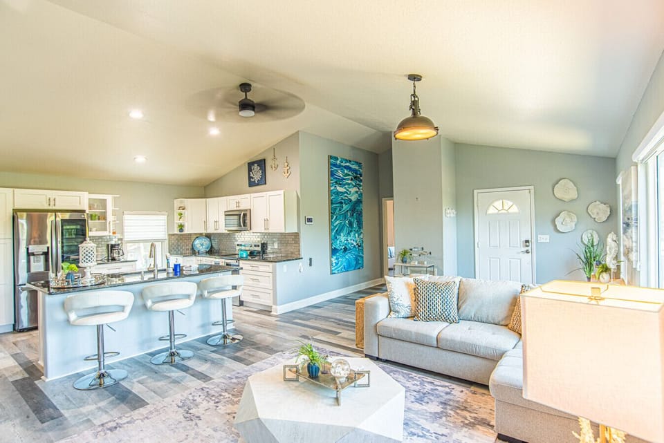 Stylish clean living area | Open to kitchen & dining | Canal Views