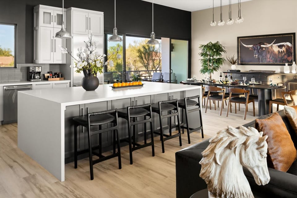 Natural light fills the open cooking and dining area