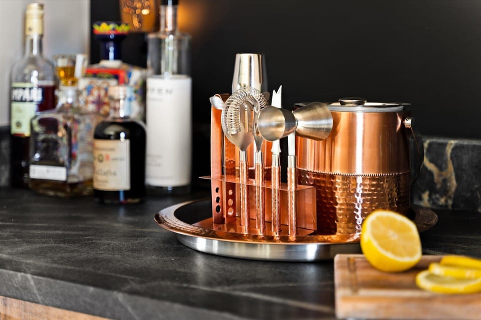 A well-stocked bar cart with spirits and mixing essentials