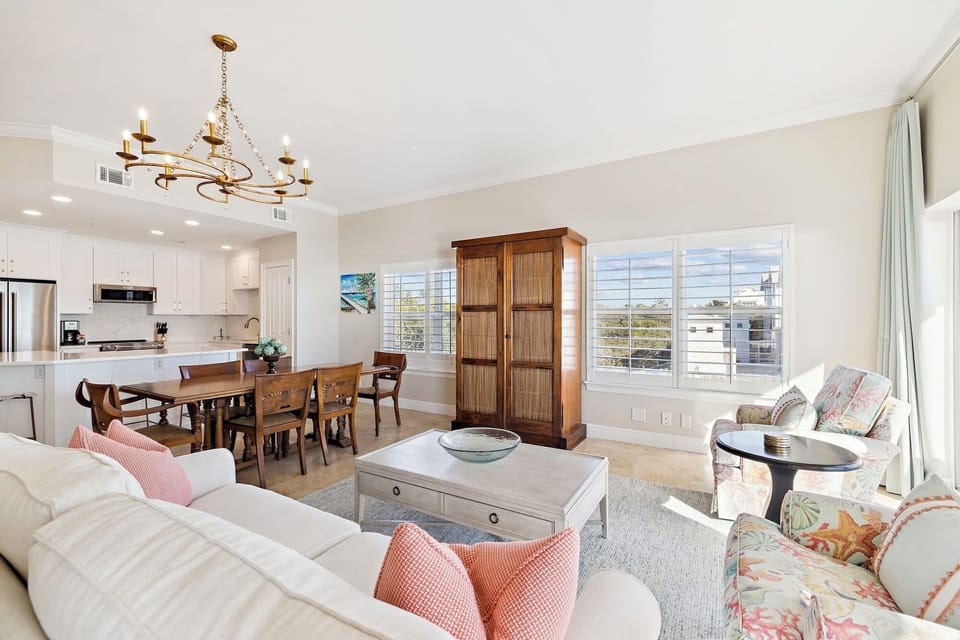 Relax in your bright, open living space where soft furnishings and elegant chandelier create the perfect atmosphere for memorable evenings together.