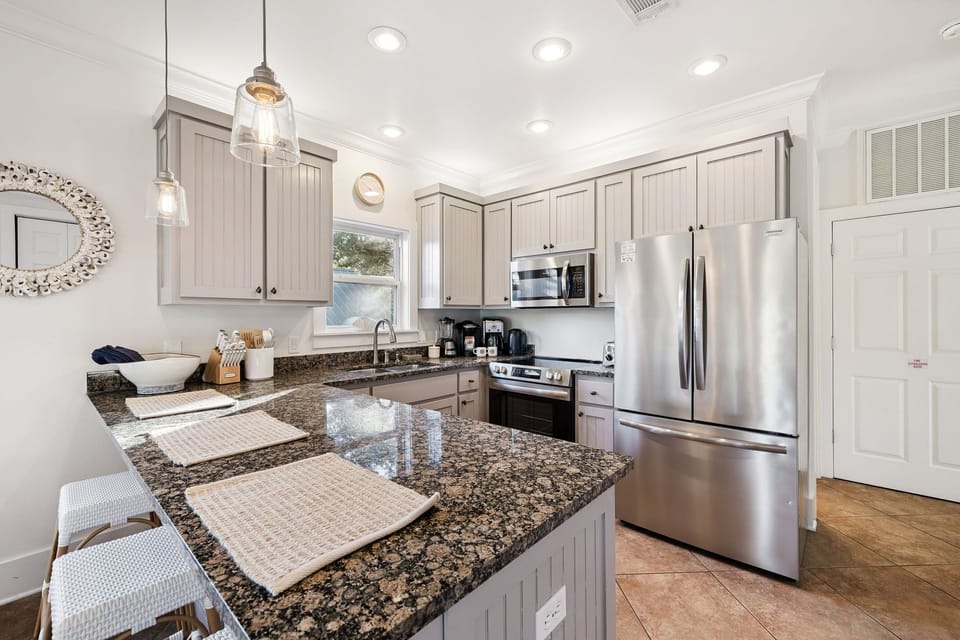 Your fully equipped kitchen awaits with granite countertops, stainless steel appliances, and everything you need to create memorable meals together.