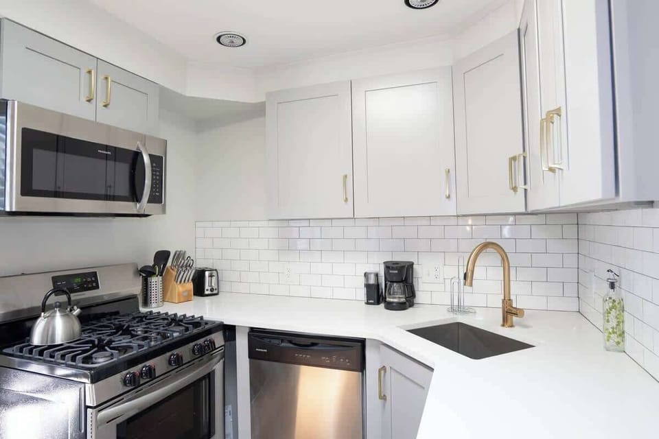 The kitchen is fully stoked with every utensil and appliance one would need to make a home cooked meal.