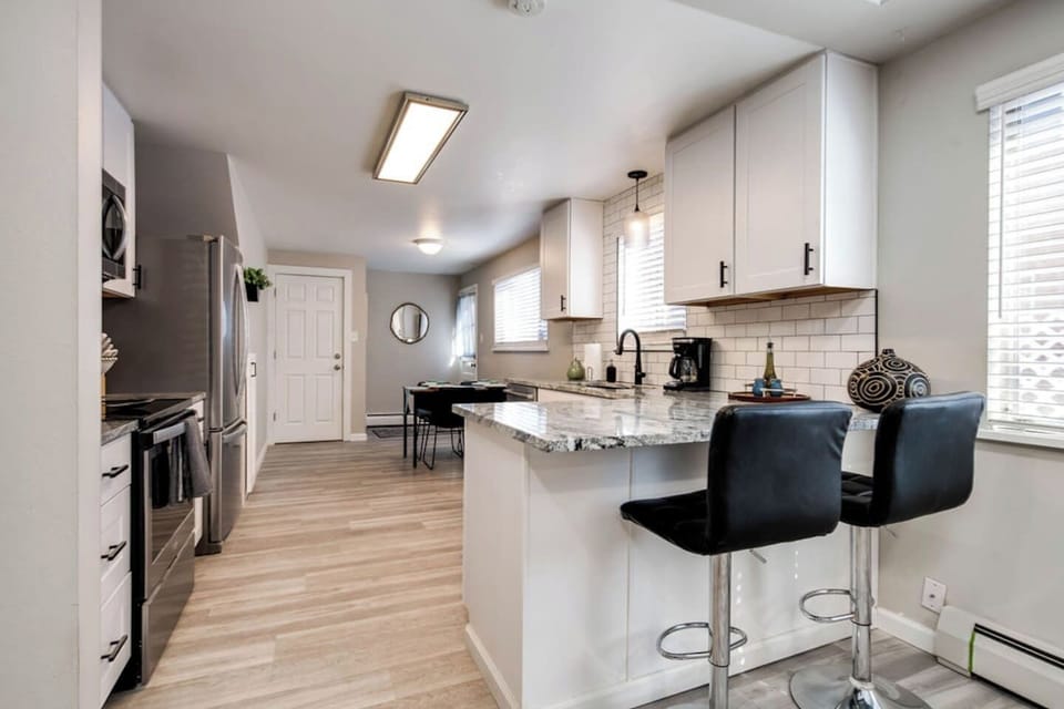 Breakfast bar and dining table accomodate you and your guests dining needs