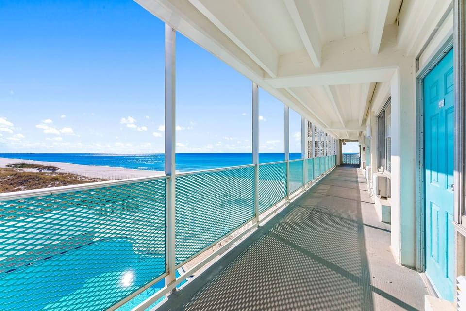 Private balcony with panoramic Gulf views and the perfect spot to catch the sunset breeze