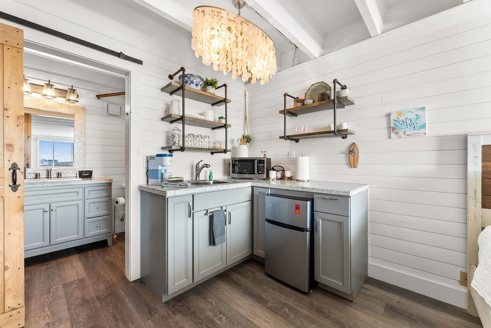 Updated kitchenette with modern appliances and everything needed for easy beach vacation meals