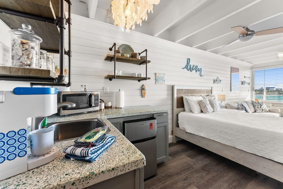 Beach-inspired kitchenette with stylish decor and thoughtful touches throughout the space
