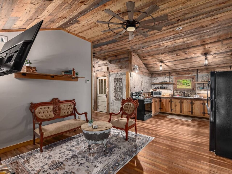 Warm rustic interiors with cozy seating and open living spaces designed for gathering together comfortably
