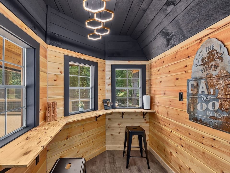 Cozy breakfast bar and coffee corner with forest views and casual seating for morning conversations