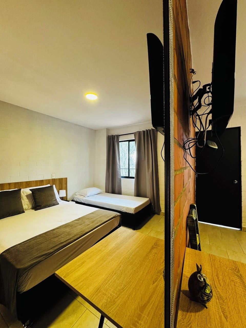 Classic Triple Room, Garden View | Desk, laptop workspace, free WiFi, bed sheets