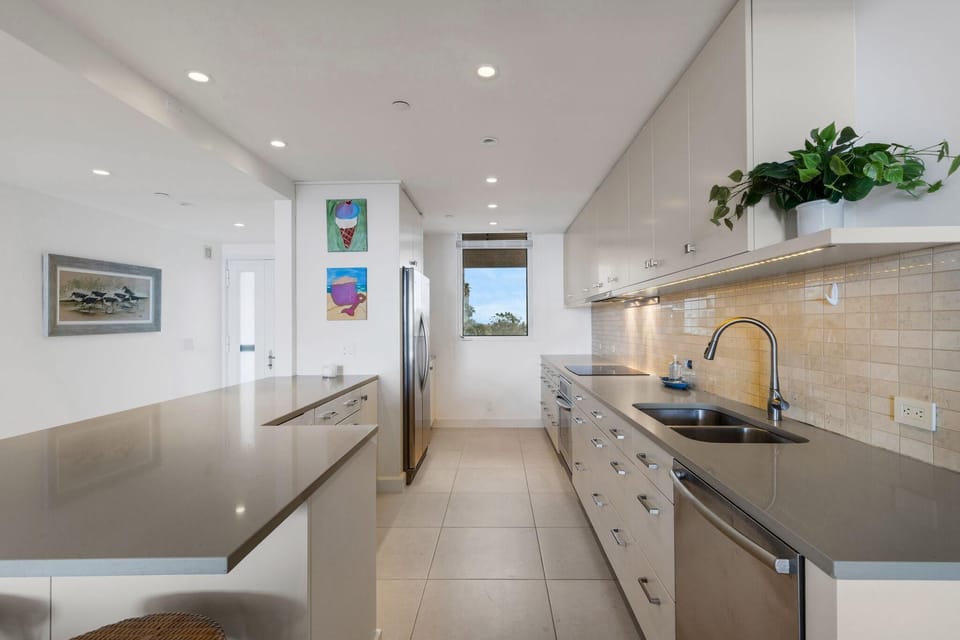 Sleek modern kitchen with spacious countertops and bright lighting