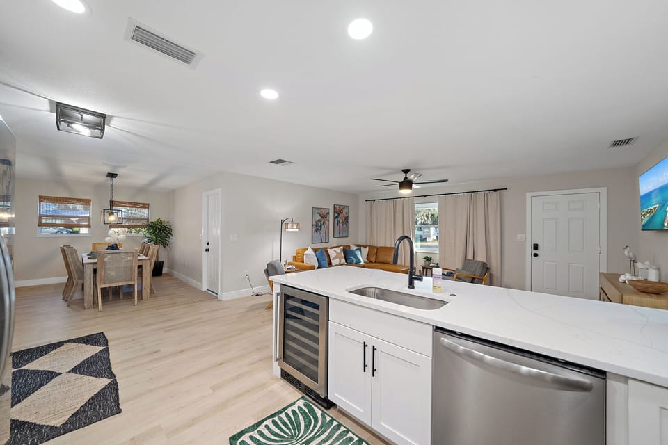 Absolutely stunning modern kitchen and bar that seats 3. The perfect spot for breakfast!
