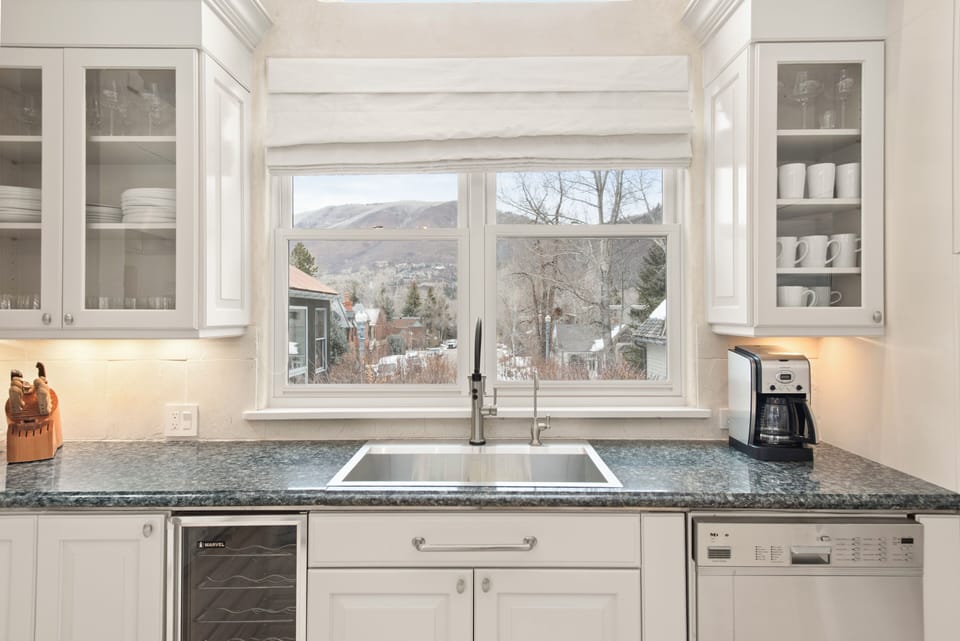 Newly remodeled, fully-stocked kitchen with double ovens.