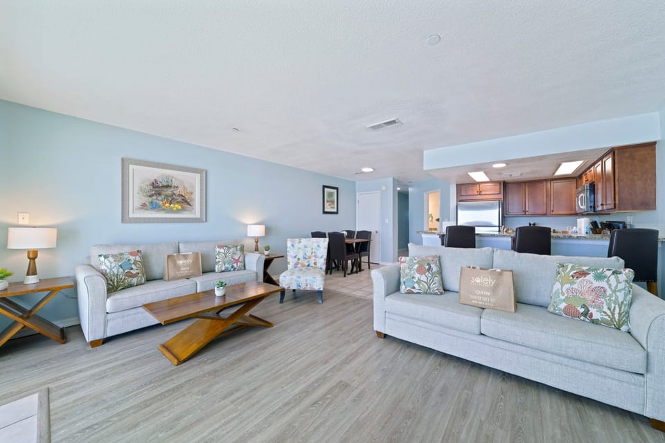 Perfect for relaxing after a beach day, the living room offers comfortable seating and front row views of the Emerald Coast.