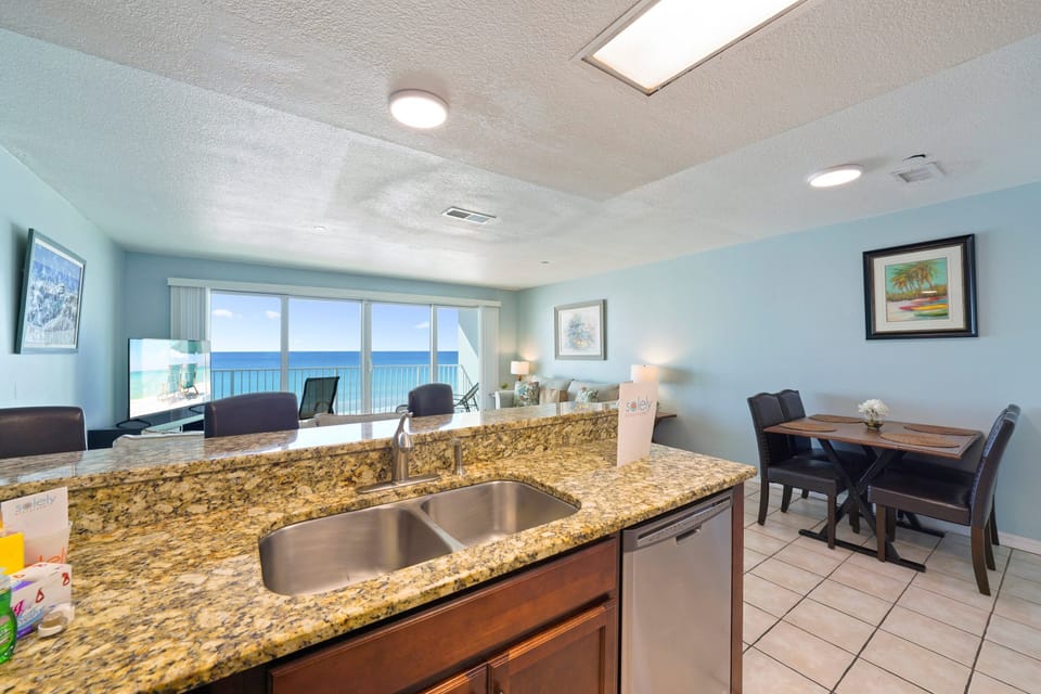 Cabana Club 403 open living space with kitchen, dining, and ocean views
