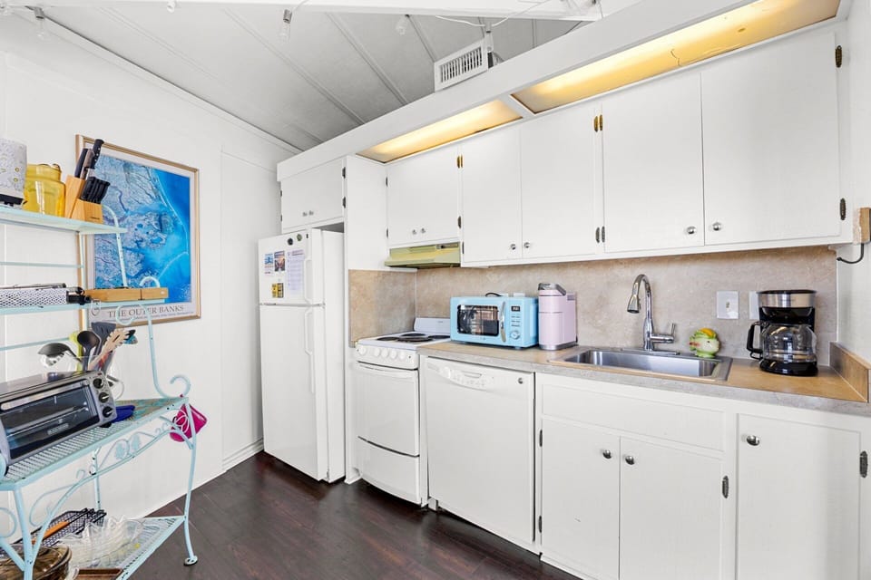 The fully equipped kitchen makes preparing meals easy and convenient, with everything you need for casual vacation cooking.