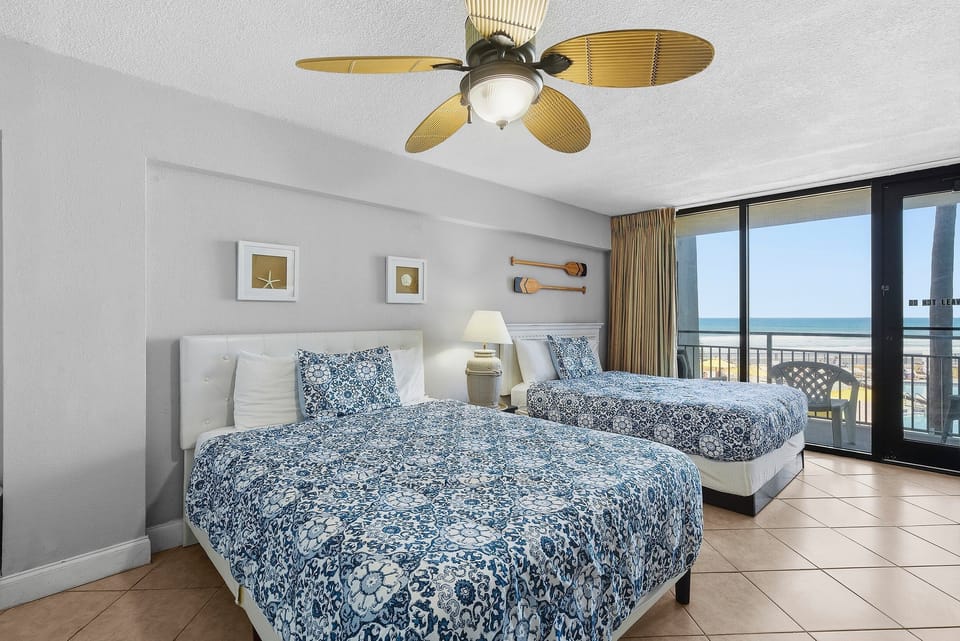 Wake up to stunning ocean views in this inviting beach stay featuring two cozy beds and a private balcony. Perfect for families or friends, this coastal vacation rental offers comfort, convenience, and easy access to the beach.