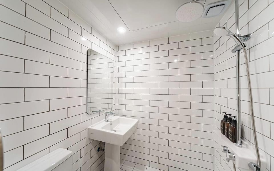 Shower, free toiletries, hair dryer, slippers