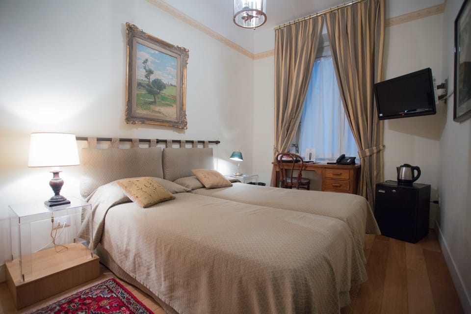 Double or Twin Room | Minibar, desk, laptop workspace, soundproofing
