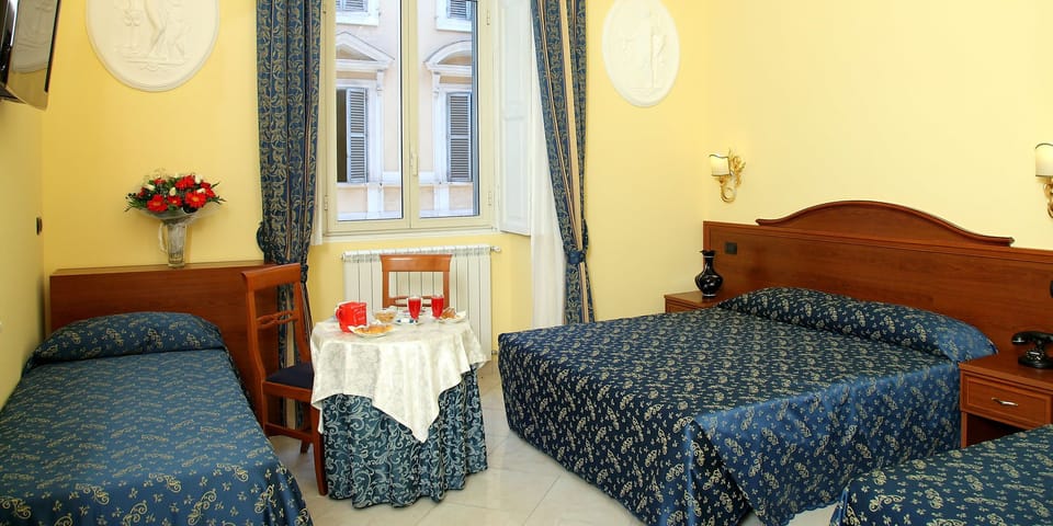Triple Room | Minibar, in-room safe, desk, laptop workspace