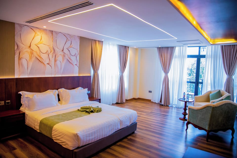 Deluxe Double Room, Balcony, Mountain View | In-room safe, desk, laptop workspace, blackout drapes