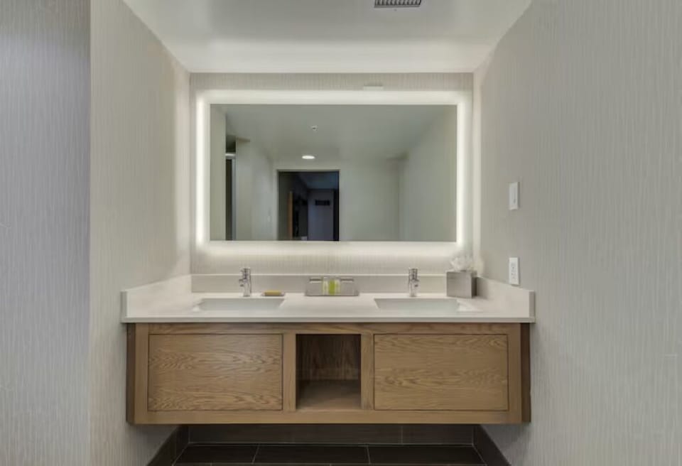 Refresh at a glowing double vanity with ample counter space.