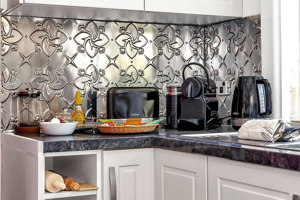Thoughtful kitchen setup with coffee machine and essentials for a comfortable stay.