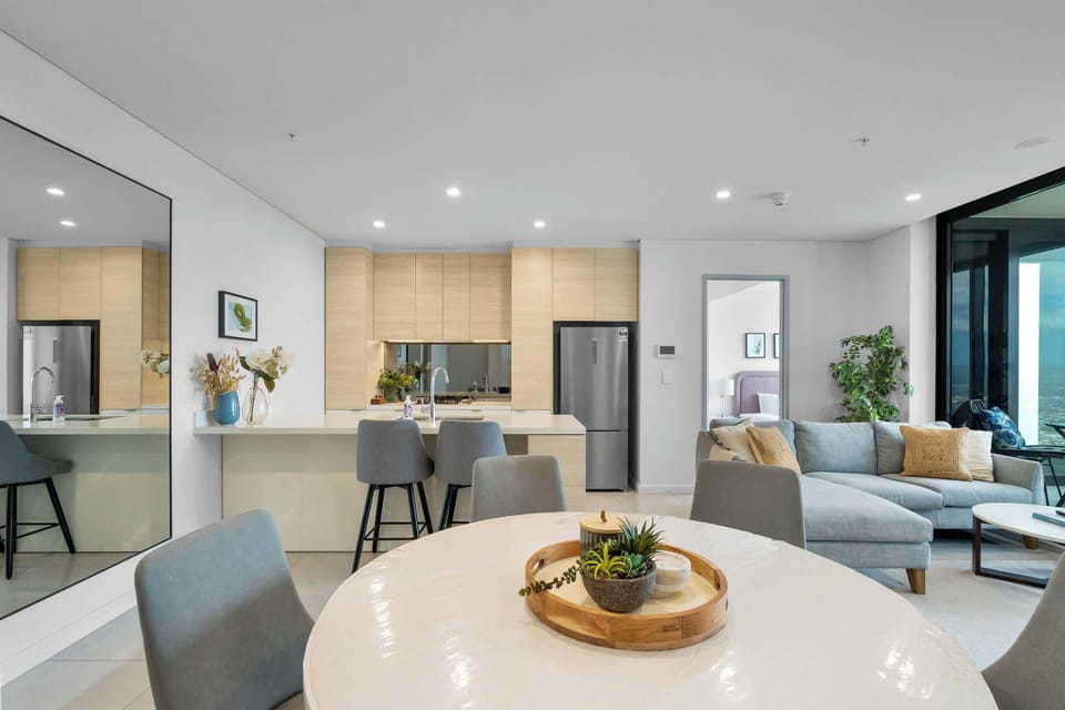 Bright dining area positioned to enjoy natural light and easy access to the kitchen and balcony.