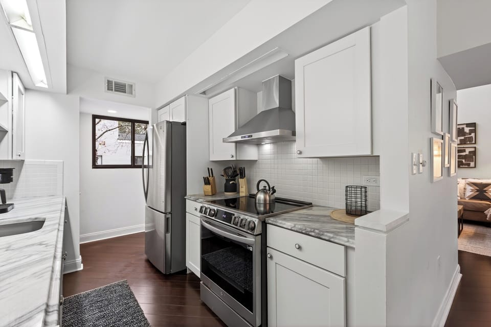 Fully equipped kitchen with stainless steel appliances.
