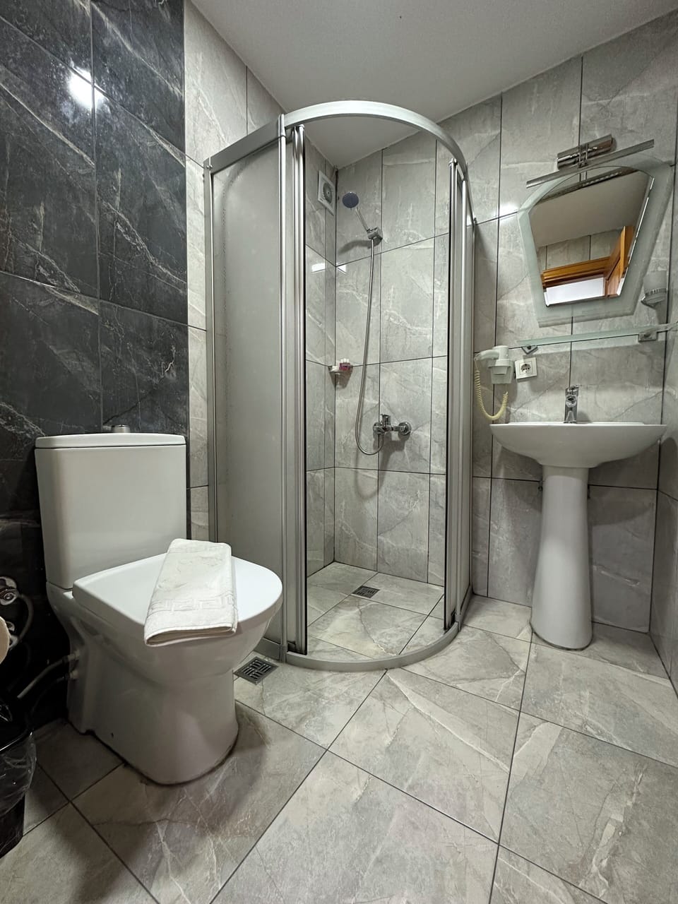 Hair dryer, slippers, bidet, towels