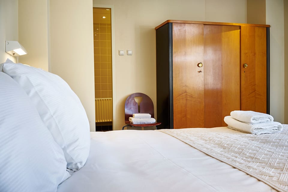 Double or Twin Room, City View | In-room safe, desk, iron/ironing board, free cribs/infant beds