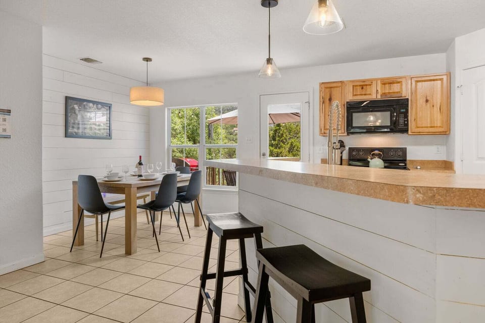 Kitchen bar + dining area opens to back deck