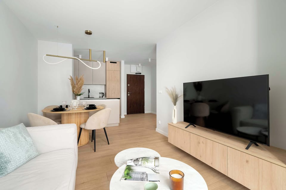 Enjoy your favorite shows on the flat-screen television in the elegant living area.