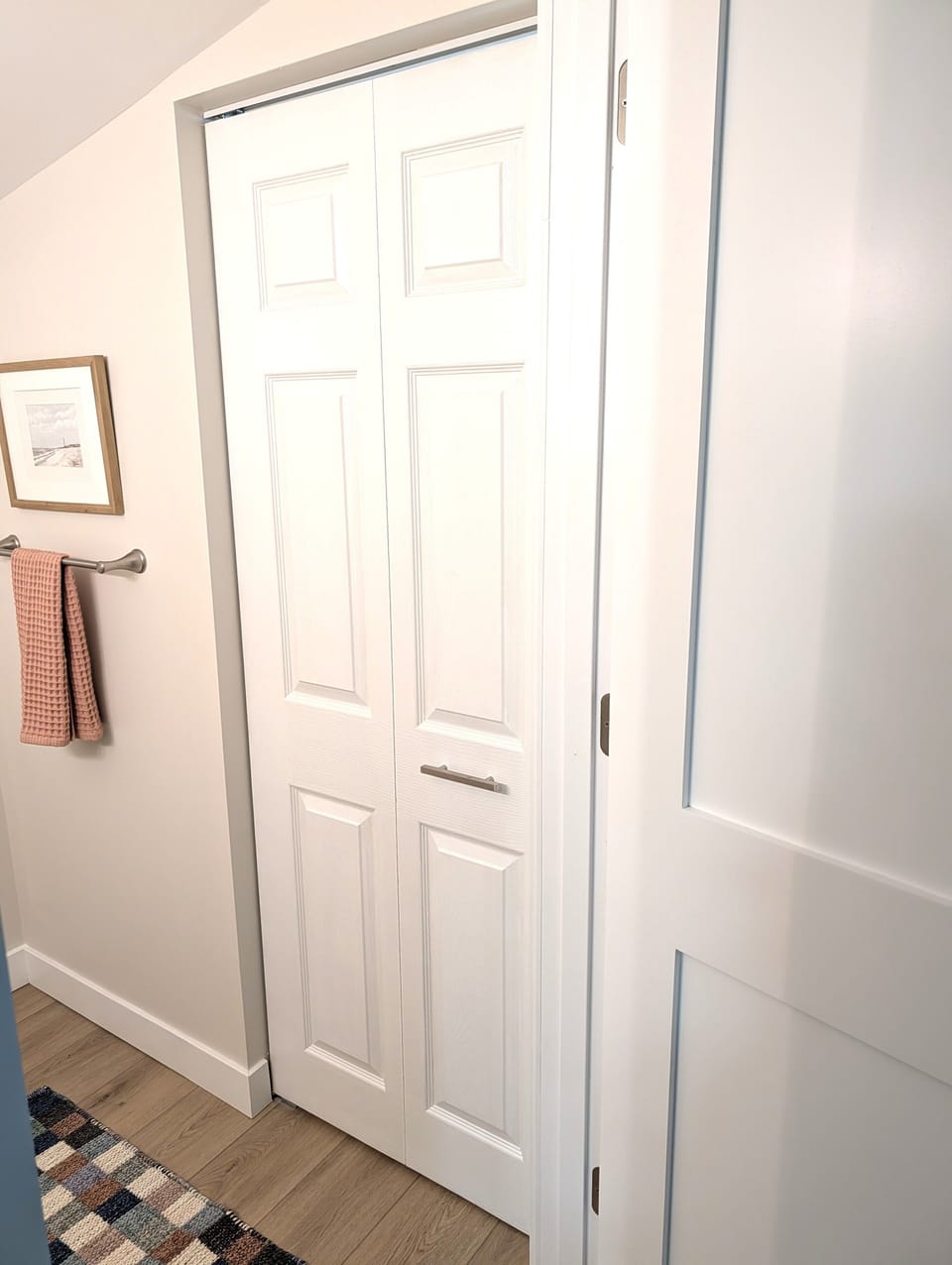 BATHROOM #2 (MAIN FLOOR):  This is a very convenient half-bathroom off of the kitchen.  It also includes a laundry closet with a stacked washer and dryer in it.