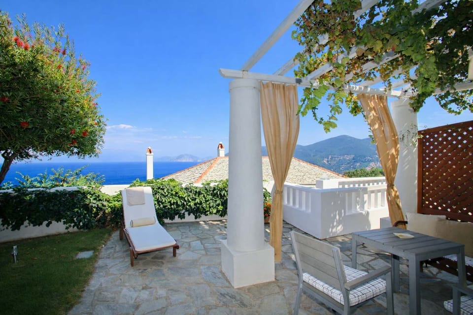 Shaded outdoor lounge for aperitivo hour.