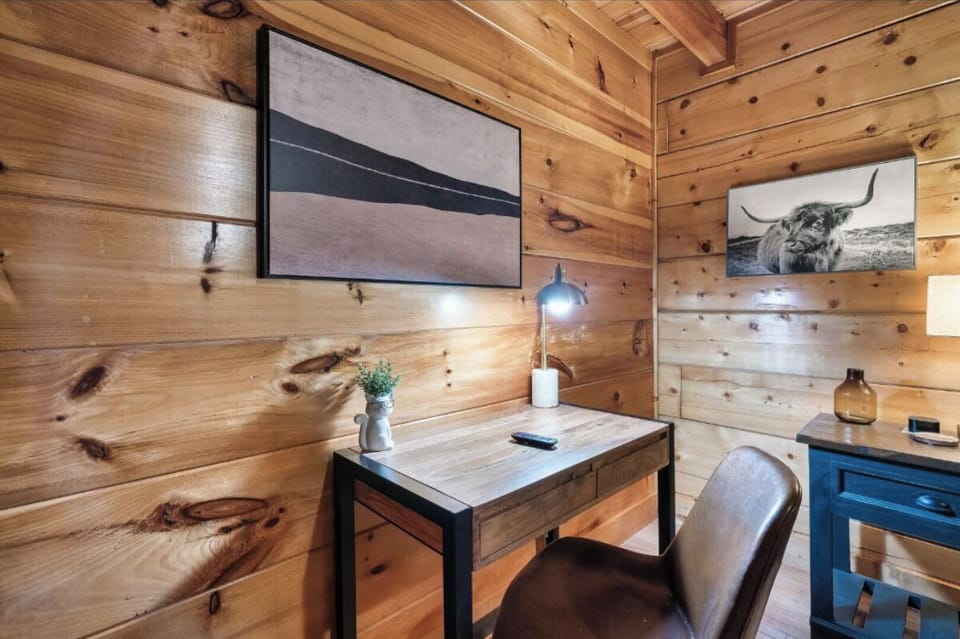 Settle into your private workspace with rustic charm and modern comfort, perfect for catching up on work or planning adventures.