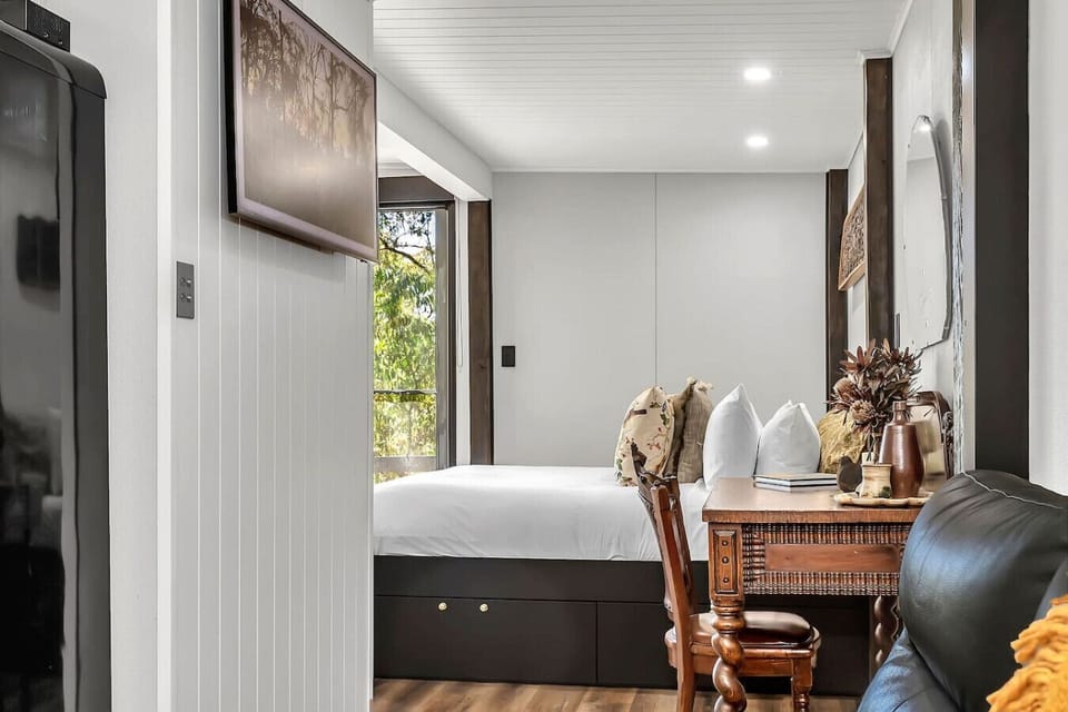 Comfortable bedroom with desk and natural light