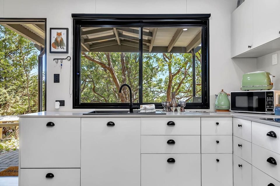Fully equipped kitchen with scenic garden views