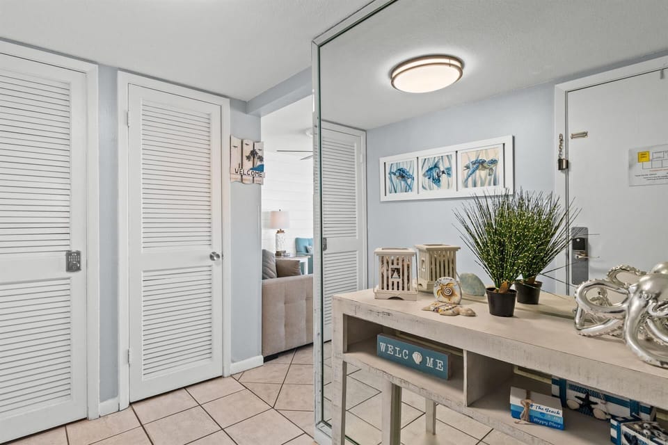 You'll love the bright, welcoming entryway with coastal touches and thoughtful decor that sets a relaxing tone for your stay.